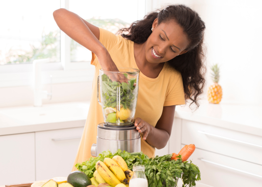 woman making a smoothie